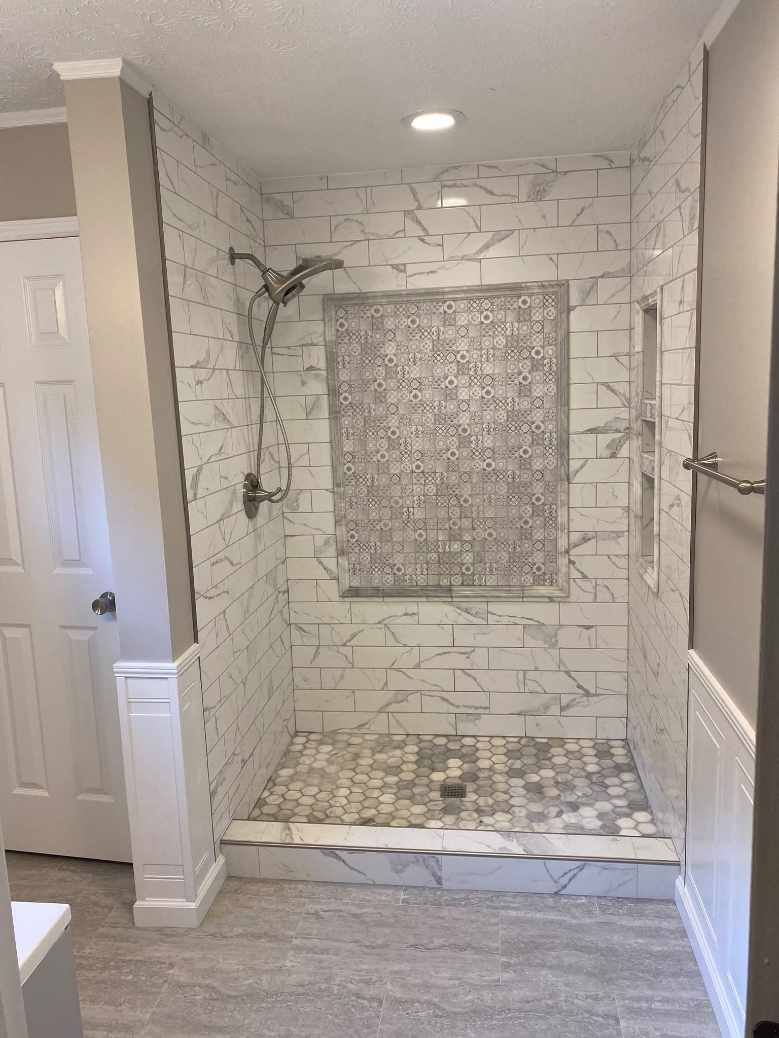 Marble Shower with Patterned Niche