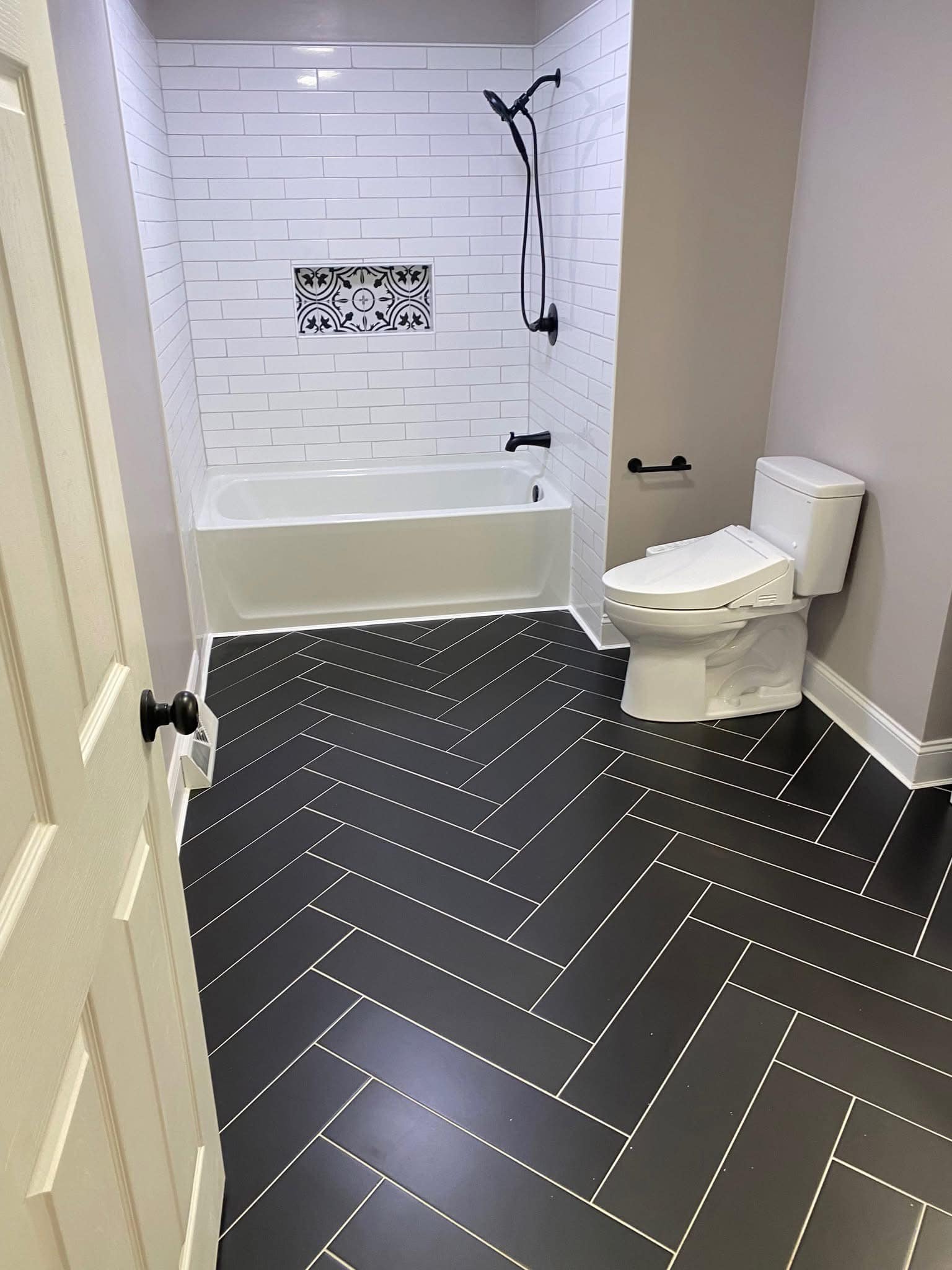 Subway Tile Bath with Herringbone Floor