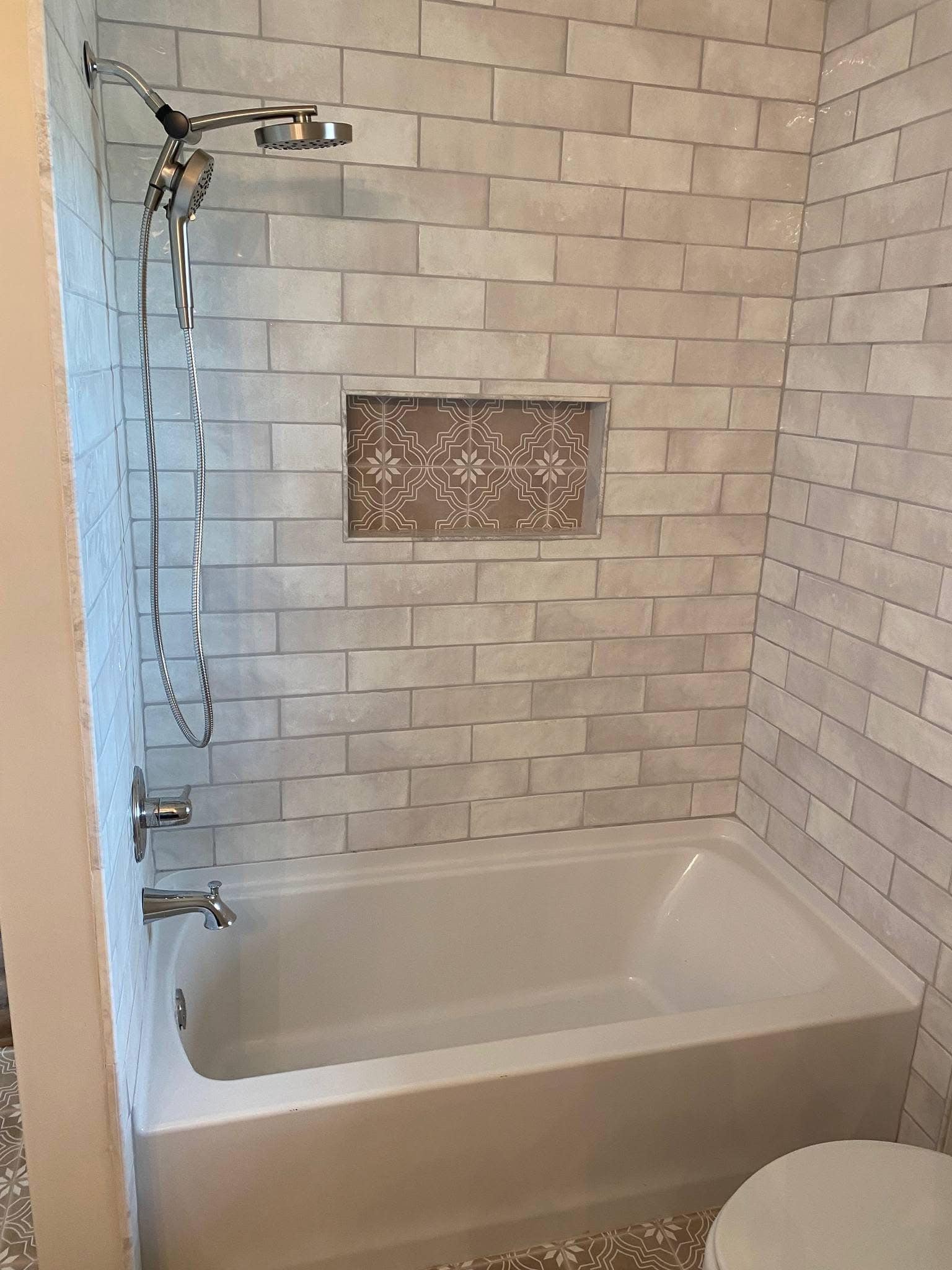 Subway Tile Bath with Patterned Niche