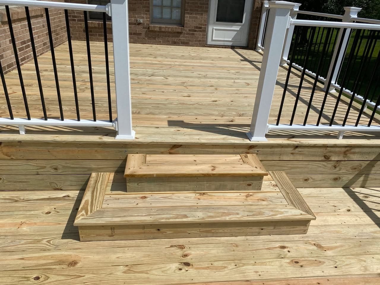 Deck Stair Detail at Brick Home