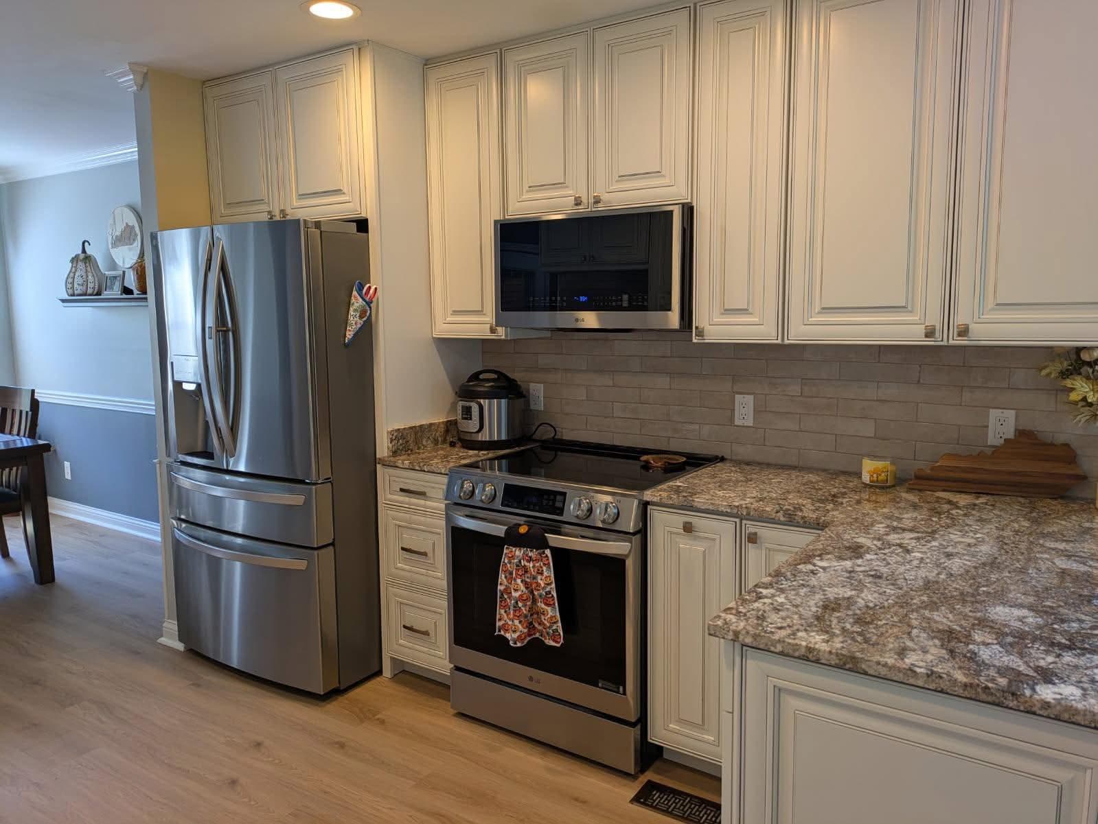Cream Kitchen with Brick Backsplash